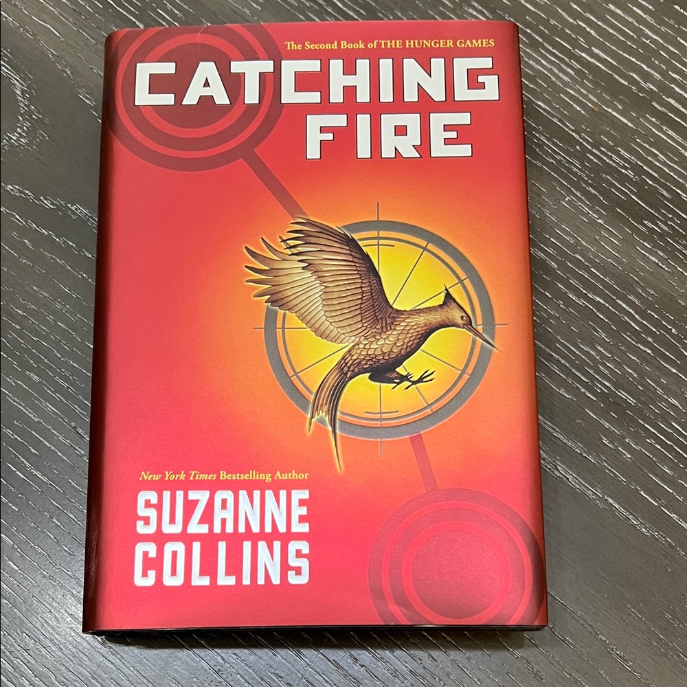Catching Fire by - Suzanne Collins Hard Cover Novel The Second Book